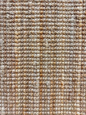 Macro shot of textured jute rug with natural beige and brown tones for interior design and home decor. High quality photo