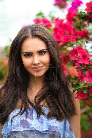 Photo for Portrait of a Beautiful girl in a crown  standing near flowers. Art work of romantic woman . - Royalty Free Image