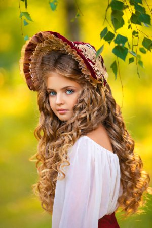Beautiful young girl in vintage dress and cute red hood outdoor. Art work of romantic girll. Pretty tenderness blonde model with huge blue eyes.