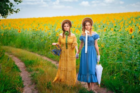 Photo for Pretty young curly girls in straw hat and vintage yellow dress standing near white flowers. Elegant lady walking in countryside.Art work of romantic tenderness model. - Royalty Free Image