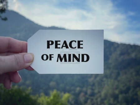 Photo for Motivational and inspirational wording. Peace Of Mind written on white paper. With blurred styled background. - Royalty Free Image