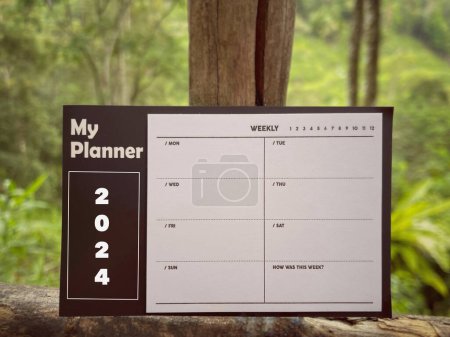 Photo for New Year motivational concept. My Planner 2024 written on notepad. With blurred styled background. - Royalty Free Image