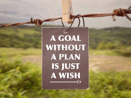 Photo for Motivational and inspirational wording. A Goal Without A Plan Is Just A Wish written on a paper. With blurred styled background. - Royalty Free Image
