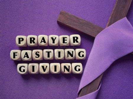 Photo for Christianity concept about Good Friday, Lent Season and Holy Week. PRAYER, FASTING,GIVING written on wooden blocks. With blurred purple background. - Royalty Free Image