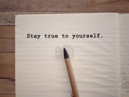 Photo for Motivational and inspirational wording. Stay True To Yourself written on a book. With blurred styled background. - Royalty Free Image