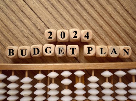 Photo for New Year financial plan concept. 2024 Budget Plan written on wooden blocks. With blurred styled background. - Royalty Free Image