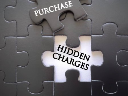 Photo for Purchasing services or goods issues. Financial management concept. HIDDEN CHARGES and PURCHASE written on puzzle set. With blurred vintage styled background. - Royalty Free Image