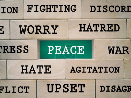 Photo for Motivational and inspirational wording. Peace concept. PEACE word and its antonym words written on wooden blocks. With blurred styled background. - Royalty Free Image
