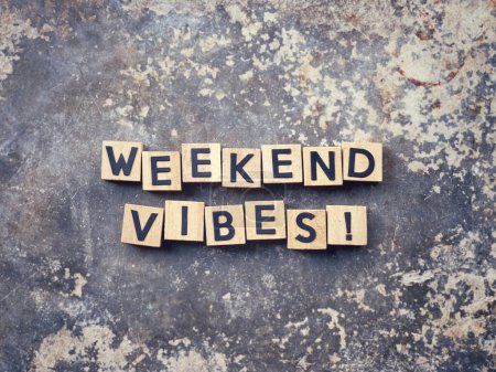 Photo for Motivational and inspirational wording. WEEKEND VIBES written on wooden blocks. With blurred styled background. - Royalty Free Image