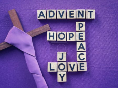 Photo for Christianity concept about Advent and Christmas season. ADVENT, HOPE, PEACE, LOVE, JOY written on wooden blocks. With blurred style background. - Royalty Free Image