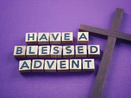 Photo for Christianity concept about Advent and Christmas season. HAVE A BLESSED ADVENT written on wooden blocks. With blurred style background. - Royalty Free Image