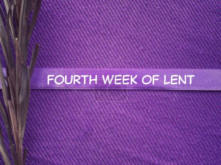 Christianity concept about Ash Wednesday, Good Friday, Lent Season and Holy Week. Fourth Week Of LENT written on a purple ribbon. With blurred style background.