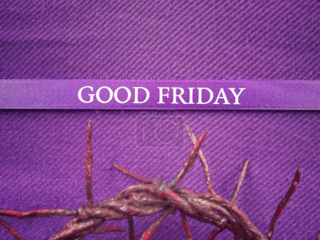 Christianity concept about Ash Wednesday, Good Friday, Lent Season and Holy Week. GOOD FRIDAY written on a purple ribbon. With blurred style background.