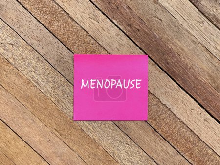 Women healthcare and medical concept. MENOPAUSE written on adhesive paper.