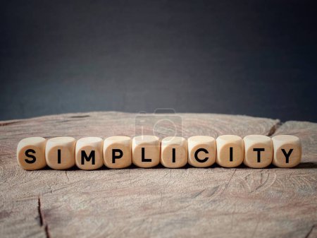 Simplicity text on wooden cubes background. National celebration day.