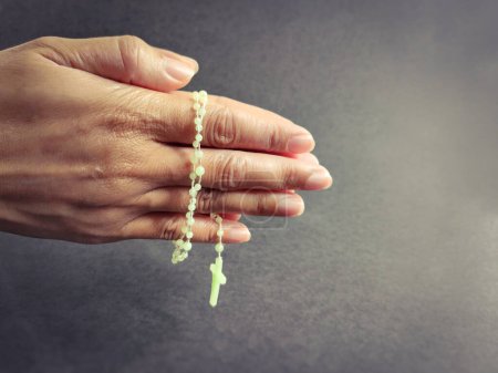 Photo for Christianity Concept - Hands holding Rosary beads background. Stock photo. - Royalty Free Image