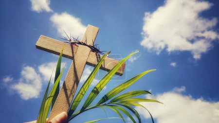 Photo for Lent,Holy Week and Good Friday concepts - photo of wooden cross raise with sky background - Royalty Free Image
