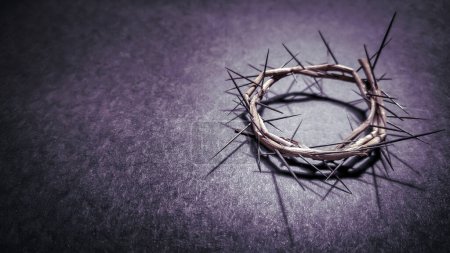Lent Season,Holy Week and Good Friday concepts - photo of crown of thorns in purple vintage background. Stock photo
