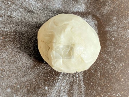 Photo for Fresh homemade wheat dough without yeast or leavening. For flatbreads making. - Royalty Free Image