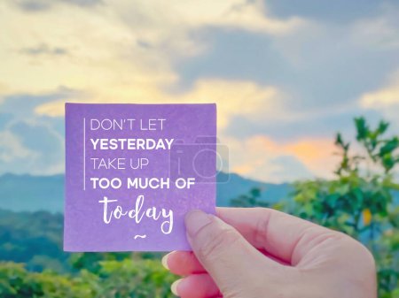 Inspirational motivational quote concept - Do not let yesterday take up too much of today on paper with blurred nature background.