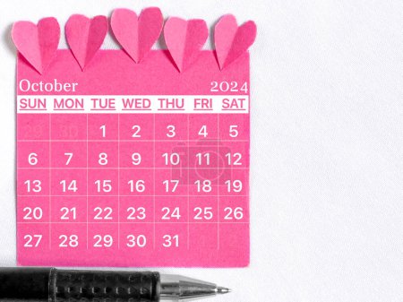 Photo for October 2024 calendar with pink color background. Women health concept. Stock photo. - Royalty Free Image
