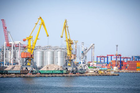 Photo for Odessa, Ukraine -08.21. 2019: View of the Odessa sea port. view of harbor cranes and container ships in the largest dock of the port . - Royalty Free Image