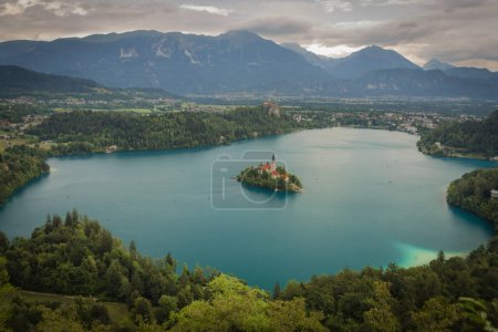 Island on lake in Bled town in Slovenia in cloudy summer rainy day