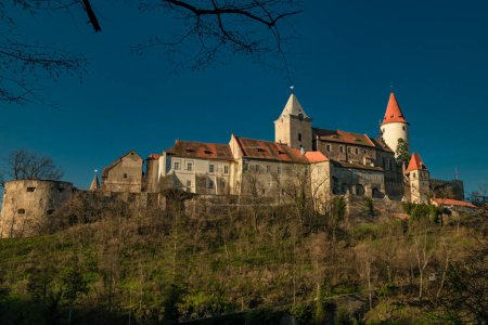 Photo for Castle in color spring sunny evening in village Krivoklat 03 18 2023 - Royalty Free Image