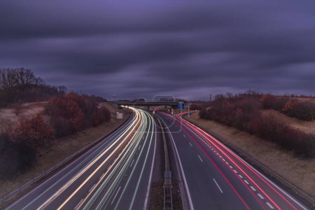 Highway near Krusne mountains with night color lines from cars
