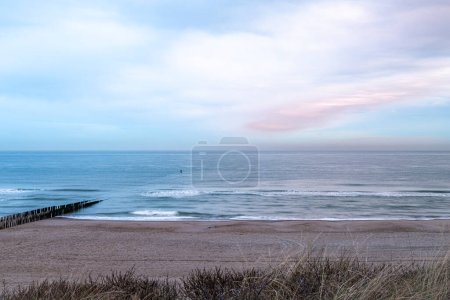 Beach near Domburg town in spring fresh morning with cloudy color sky