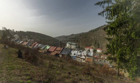 Spa town from green forest over valey with streets of Jachymov