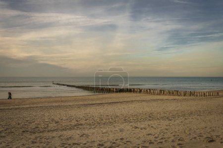 Beach near Domburg town in spring fresh morning with cloudy color sky