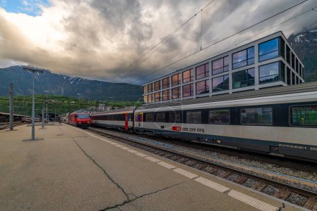 Foto de Main station in spring cloudy dark evening in Brig Switzerland 05 08 2024 - Imagen libre de derechos