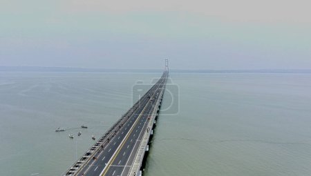 Photo for November 21, 2022. Aerial view of Suramadu bridge in the foggy afternoon in Surabaya, Indonesia - Royalty Free Image