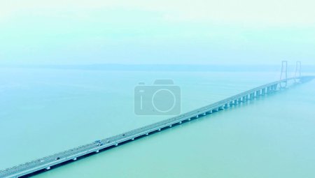 Photo for November 21, 2022. Aerial view of Suramadu bridge in the foggy afternoon in Surabaya, Indonesia - Royalty Free Image