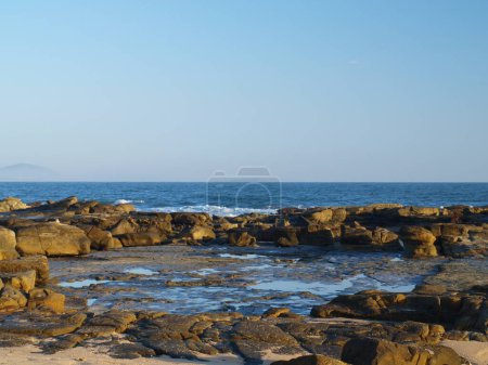 Photo for The rocky beach of Mooloolaba, Queensland, Sunshine Coast, Australia in the morning. - Royalty Free Image