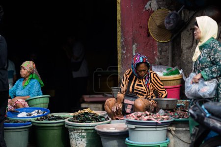 Photo for The traditional fish market on Pabean street, Surabaya. Indonesia. January 2, 2023. Editorial - Royalty Free Image