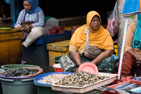 Photo for The traditional fish market on Pabean street, Surabaya. Indonesia. January 2, 2023. Editorial - Royalty Free Image
