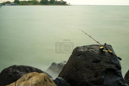 Photo for Rocks on the Marina Beach Semarang. Indonesia. Slow speed photography. Defocused. - Royalty Free Image