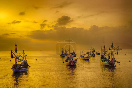 Photo for Shaky boats in long exposure photography : Moored boats during sunrise in Satelit Beach Banyuwangi - Royalty Free Image