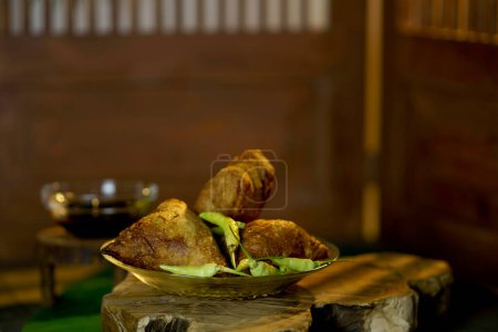 Photo for Martabak Bihun Madura or Maduranese vermicelly stuffed fried cake. served on the wooden board indoor. - Royalty Free Image
