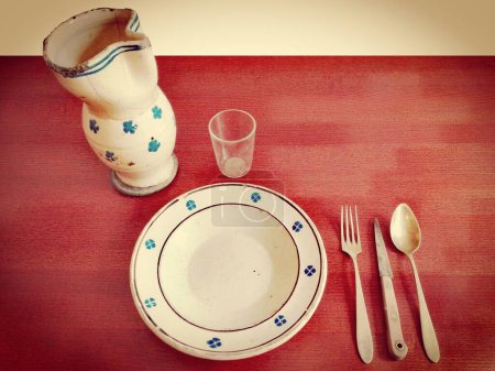Photo for Original Antique Tableware: Dish Plate, Jug, Glass, Cup, Knife, Fork, Spoon, Coffee Spoon, nickel silver cutlery. - Royalty Free Image