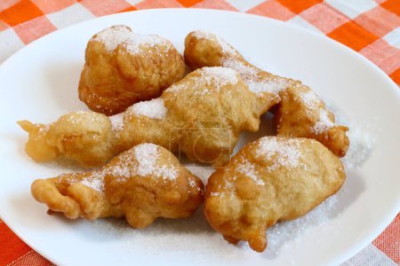 SFINCI Traditional Sicilian Italian Fried Doughnuts while frying in vegetable oil