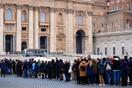 Photo for Vatican City, Holy See  January 2, 2023: Queue of people waiting to enter at St. Peter's Basilica to see the body of the late Pope Emeritus Benedict XVI to say their final farewell - Royalty Free Image