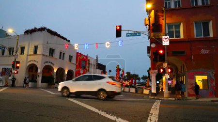 Photo for Venice Beach (Los Angeles), California  July 1, 2023: VENICE Sign by night at the intersection of Windward Ave and Pacific Ave - Royalty Free Image
