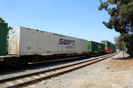Photo for Los Angeles, California  July 6, 2023: freight train with SWIFT Container blocks - Royalty Free Image