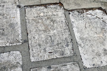 Photo for Los Angeles, California  September 22, 2023: Concrete Newspapers of Los Angeles, Historic Los Angeles Times Front Pages Cast in Cement embedded in the Sidewalk at 6006 La Prada Street - Royalty Free Image