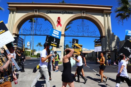 Photo for Los Angeles, California, United States. 5th Oct, 2023. Striking Members of SAG-AFTRA and other union supporters picket outside Paramount Pictures on Melrose Ave. Nearly all television or film actors joined the Writers Guild of America - Royalty Free Image