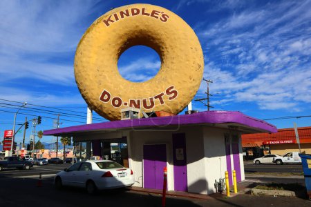 Photo for Los Angeles, California - November 22, 2023: Kindle's Donuts with a giant doughnut on the roof located at 10003 Normandie Ave, Los Angeles - Royalty Free Image