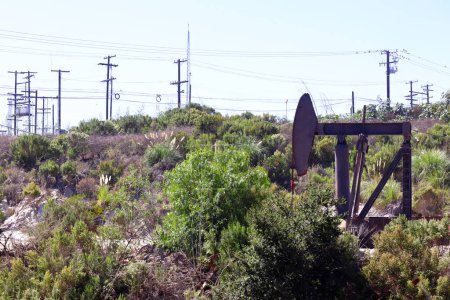 Photo for Los Angeles, California - October 4, 2023: view of The Inglewood Oil Field pumpjack located in the Baldwin Hills - Royalty Free Image